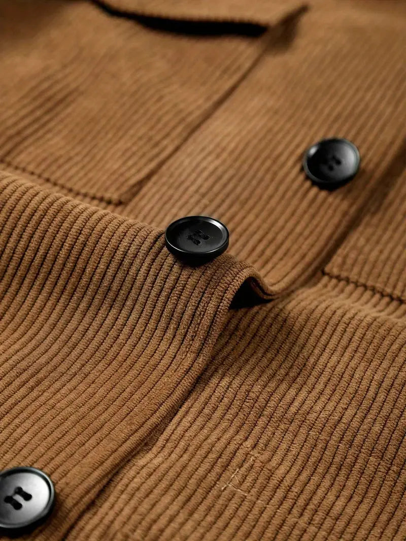 Close-up of a brown corduroy jacket with black buttons