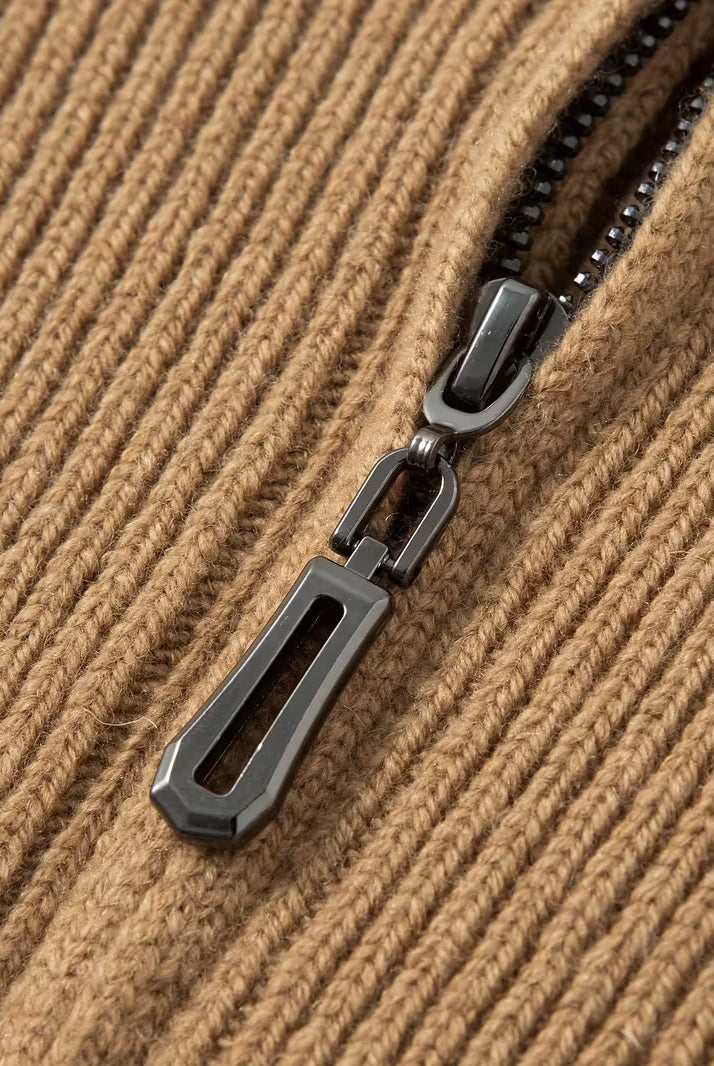 Close-up of a zipper on a textured brown fabric background