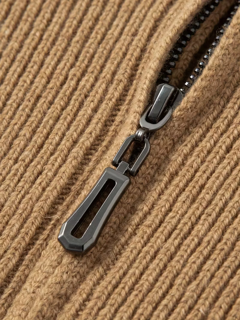 Close-up of a zipper on a textured brown fabric background