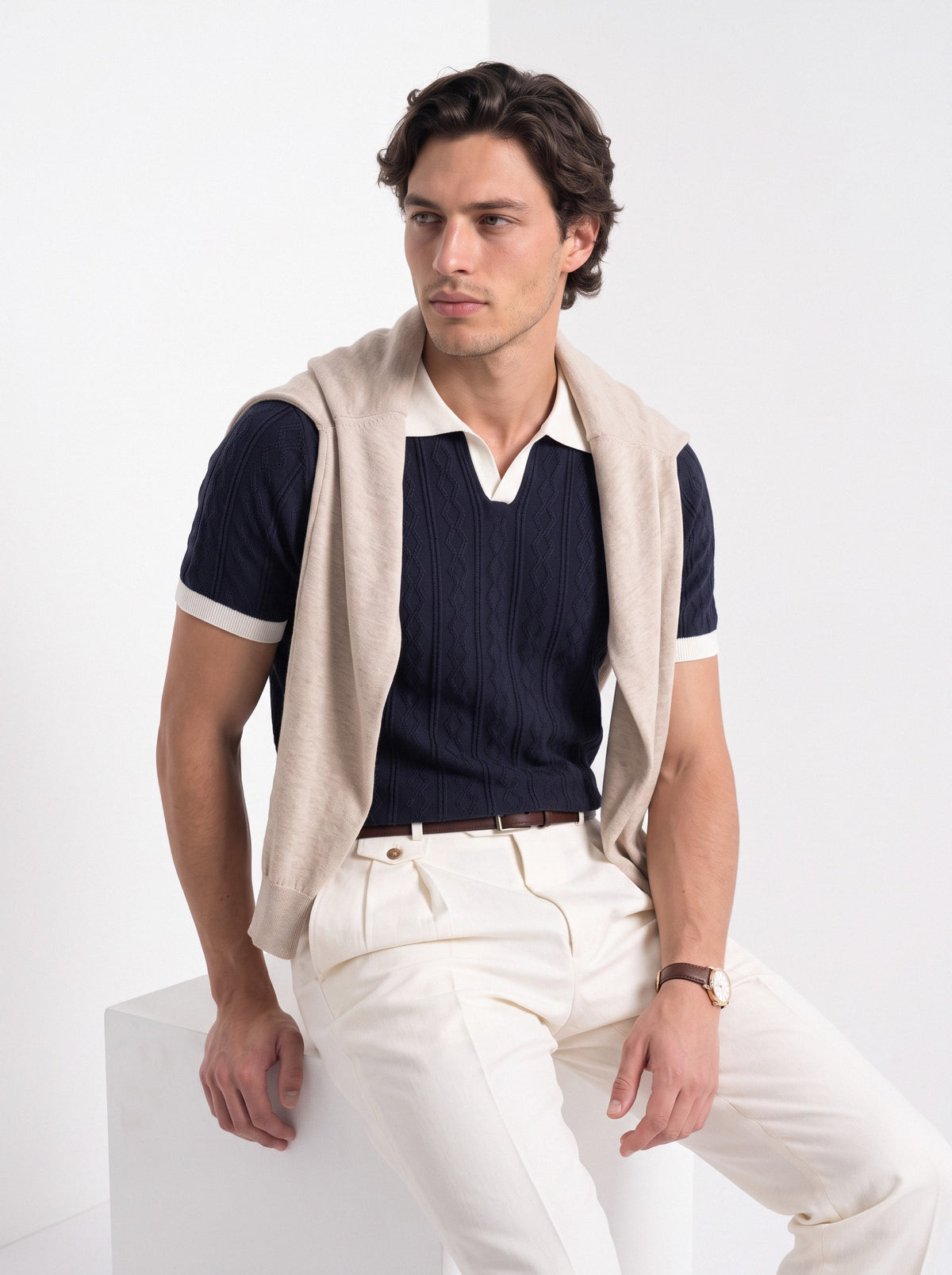 Men's diamond knit polo in navy and white, styled