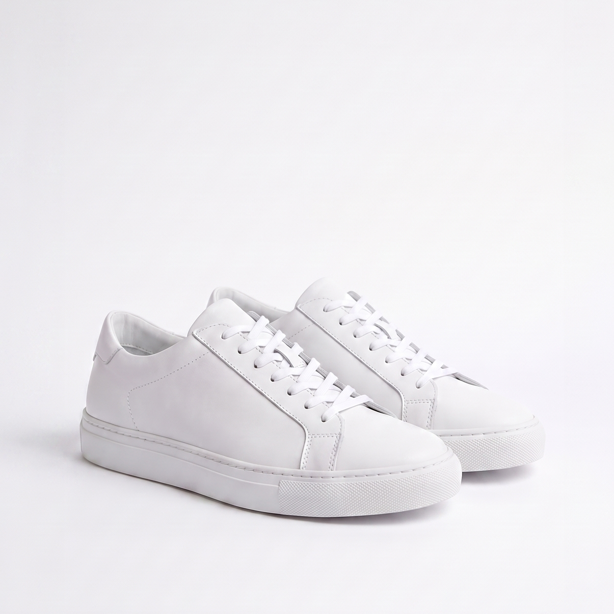 White sneakers on a light gray background