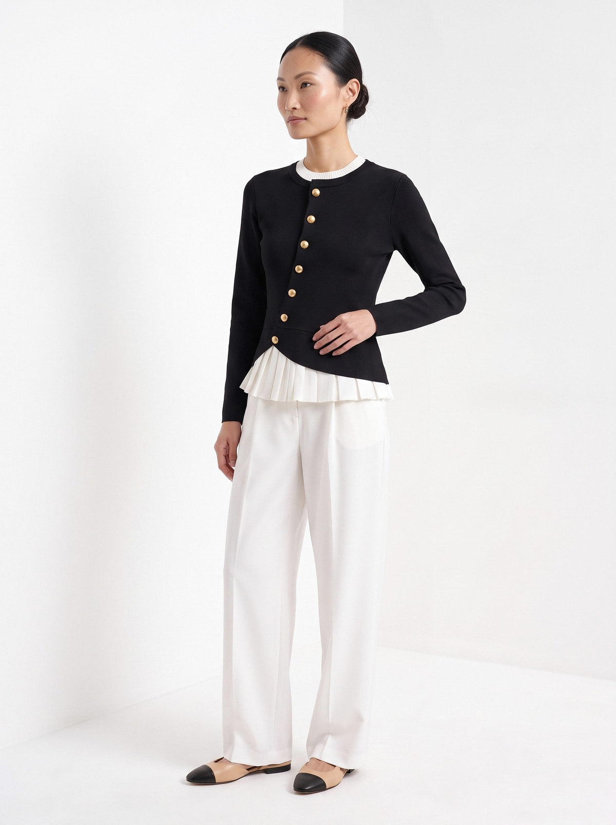 BLENIN gold button knit top in black, three-quarter view