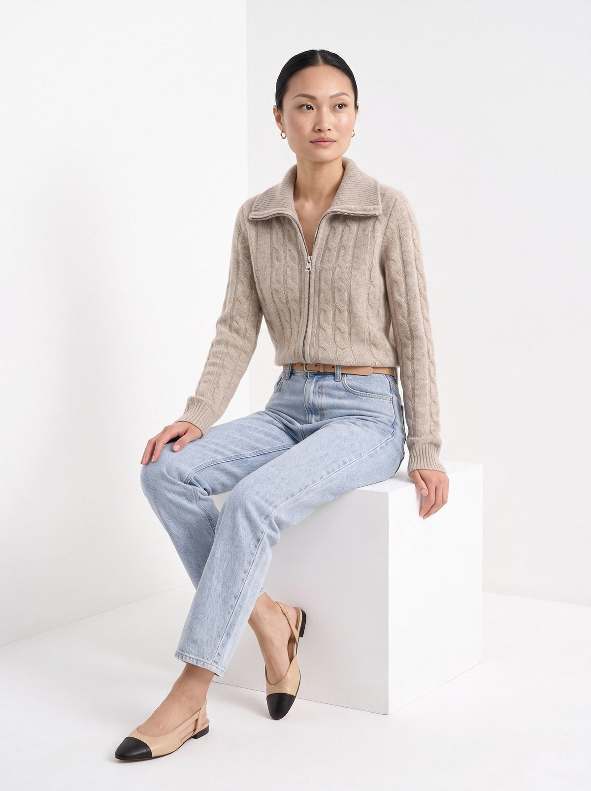 BLENIN cable zip collar cardigan in camel, seated, full outfit