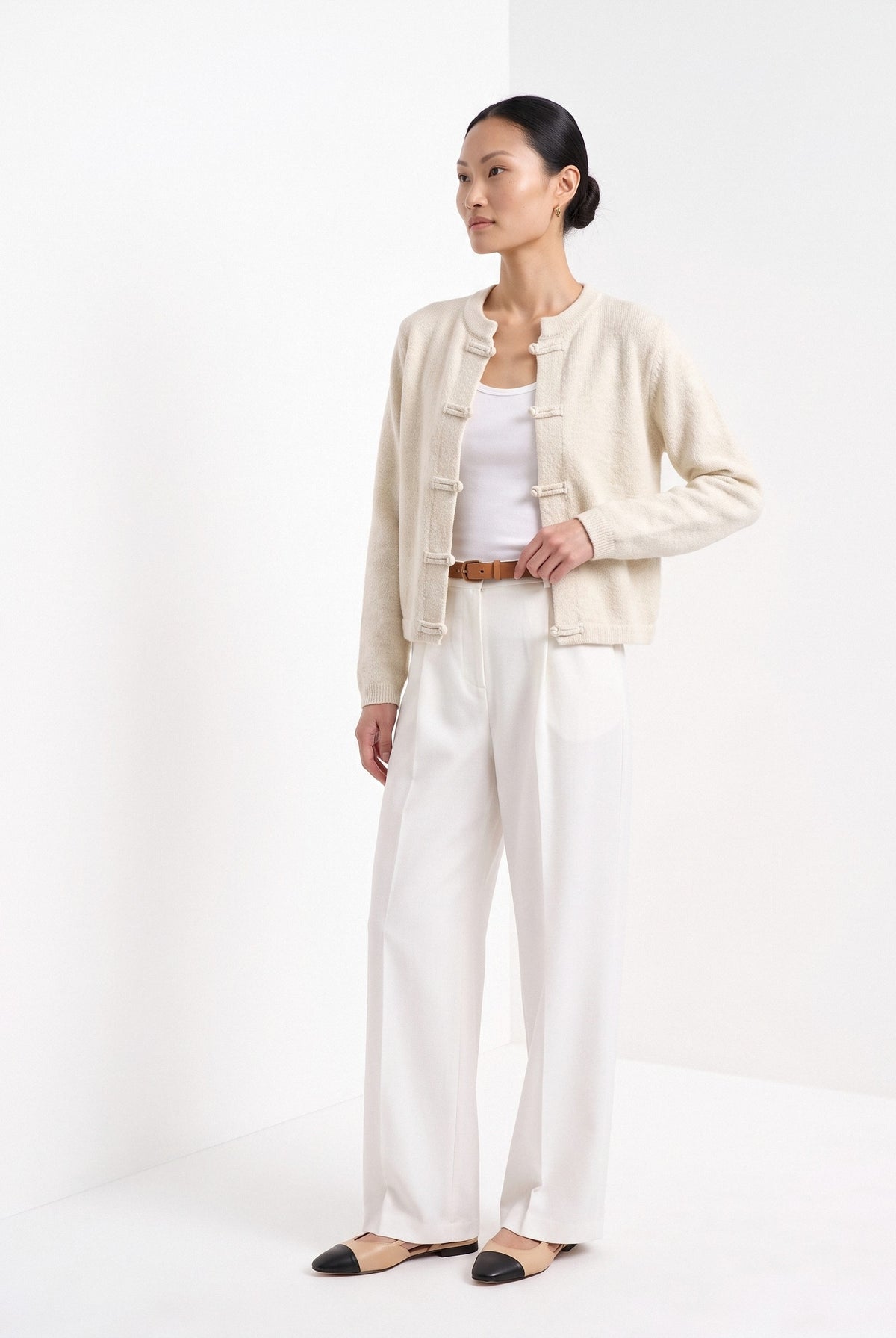 BLENIN knot button cardigan in cream, three-quarter view