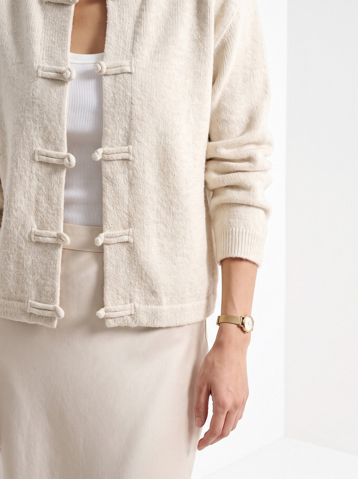 BLENIN knot button cardigan in cream, fit detail at the hem and cuff