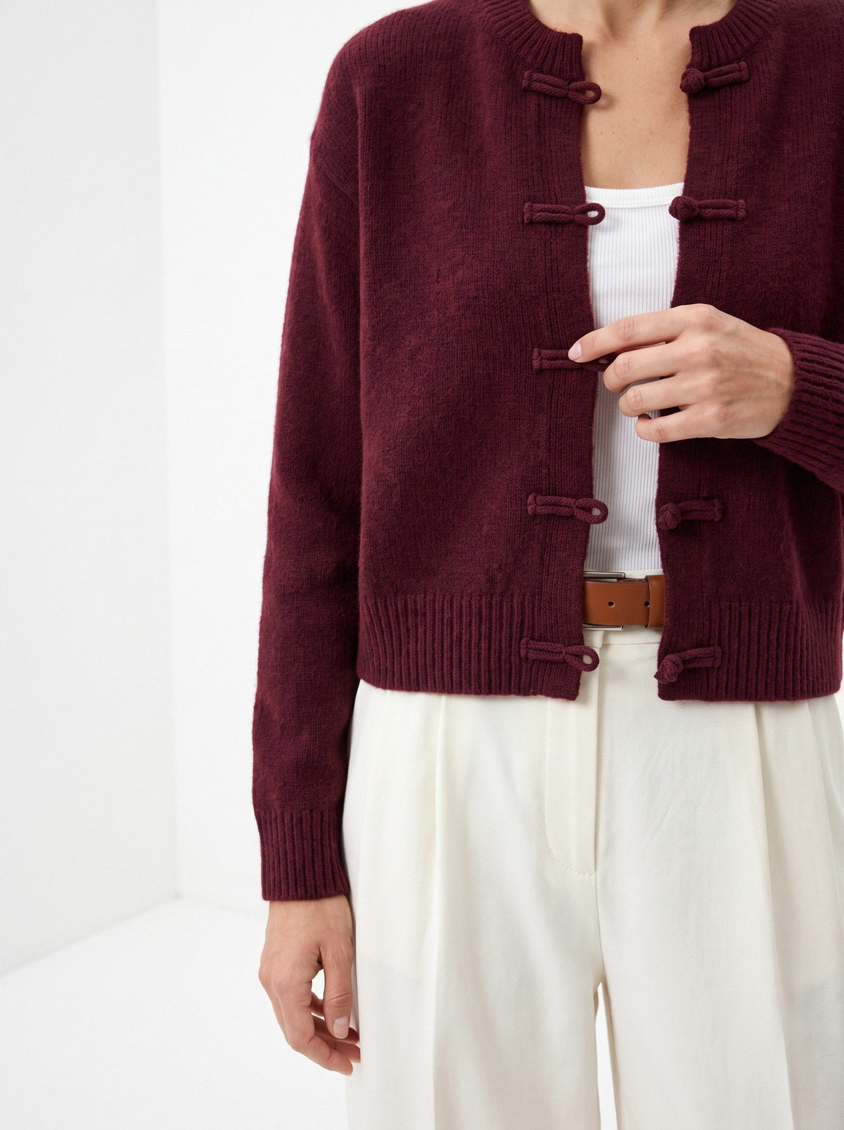 BLENIN knot button cardigan in burgundy, close-up of the details