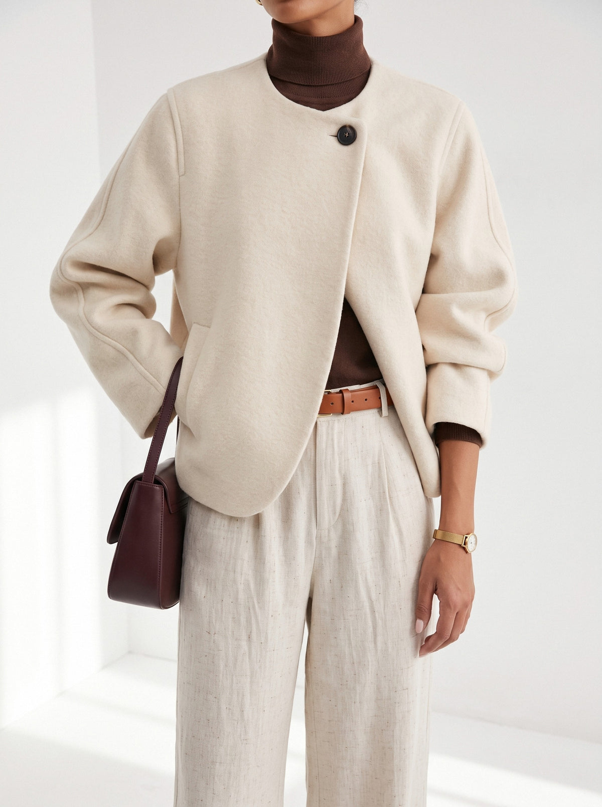 BLENIN collarless short coat in cream, fit detail at the hem and cuff