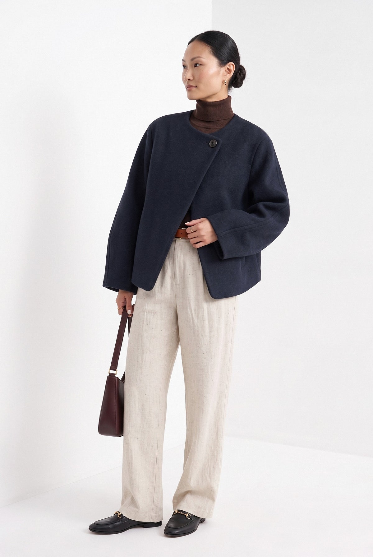 BLENIN collarless short coat in navy, three-quarter view