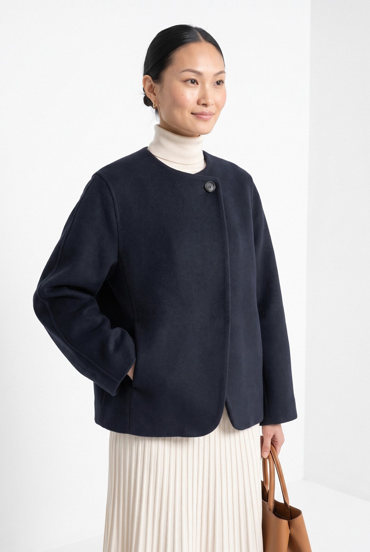 BLENIN collarless short coat in navy, front portrait