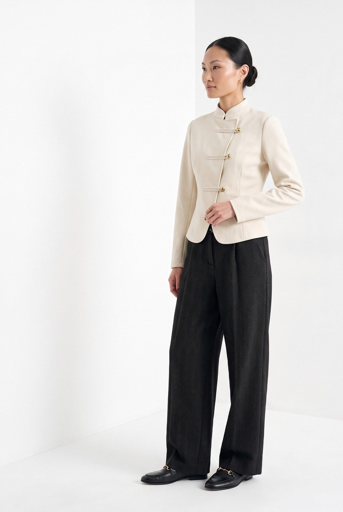 BLENIN herringbone wide leg trousers in black, three-quarter view