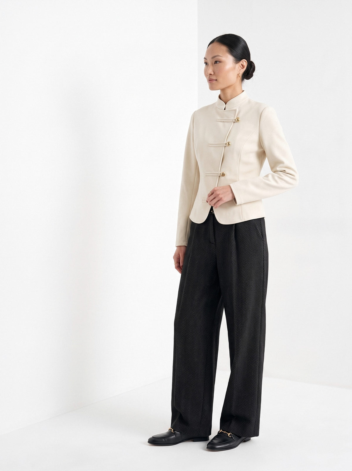 BLENIN herringbone wide leg trousers in black, three-quarter view