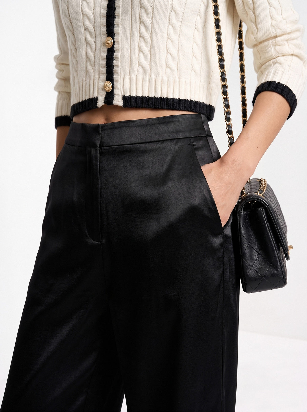 BLENIN satin wide leg trousers in black, close-up of the details