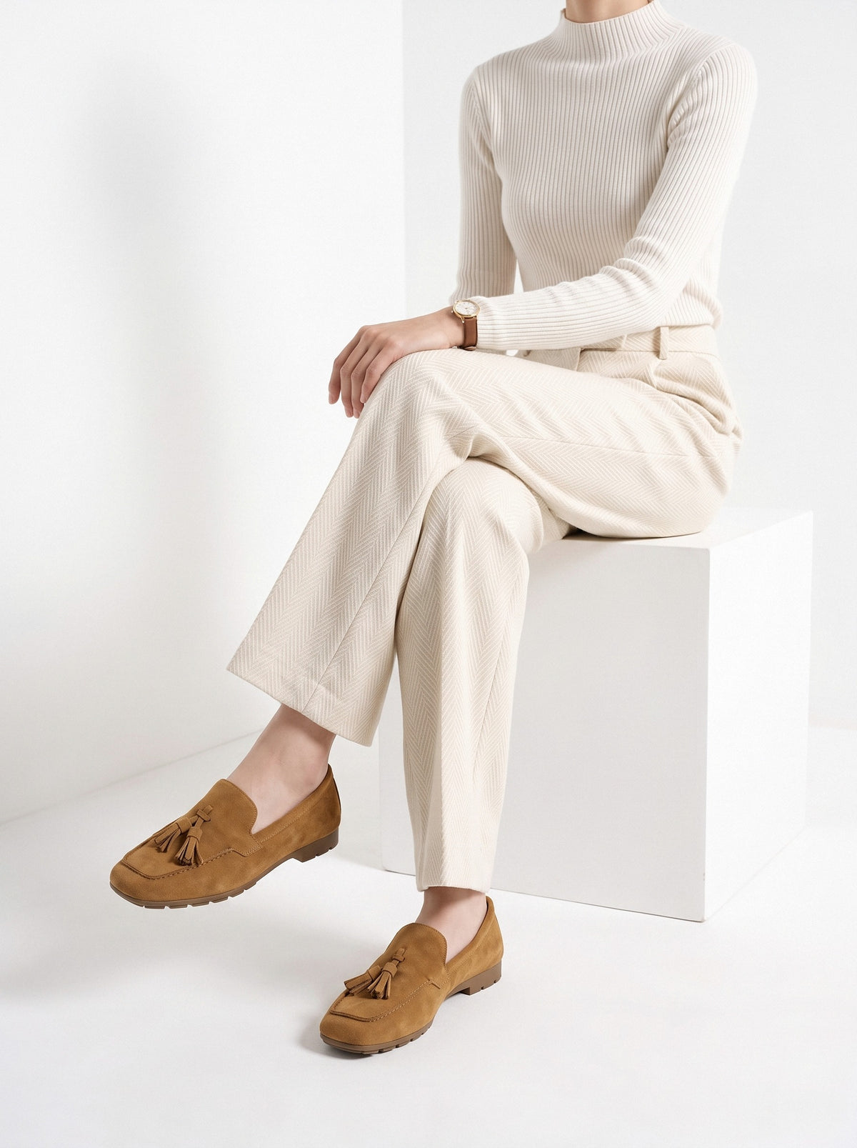 BLENIN women's suede-look tassel loafers in tan, seated, side view
