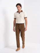 Men's diamond knit polo in cream and brown, full-length