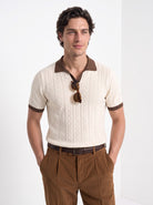 Men's diamond knit polo in cream and brown, front portrait