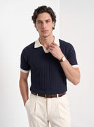 Men's diamond knit polo in navy and white, front portrait
