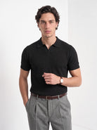 Men's cotton knitted polo shirt in black, front portrait