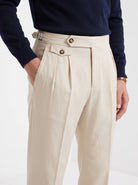 Men's high waisted trousers in beige, close-up detail