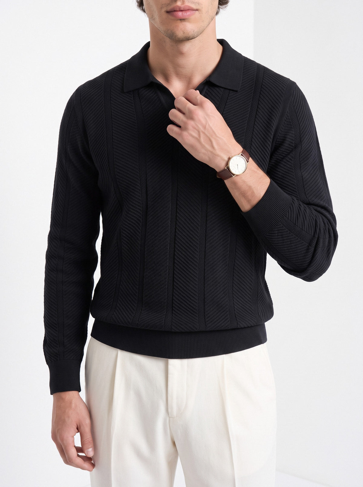 Men's long sleeve textured knitted polo in black, close-up detail