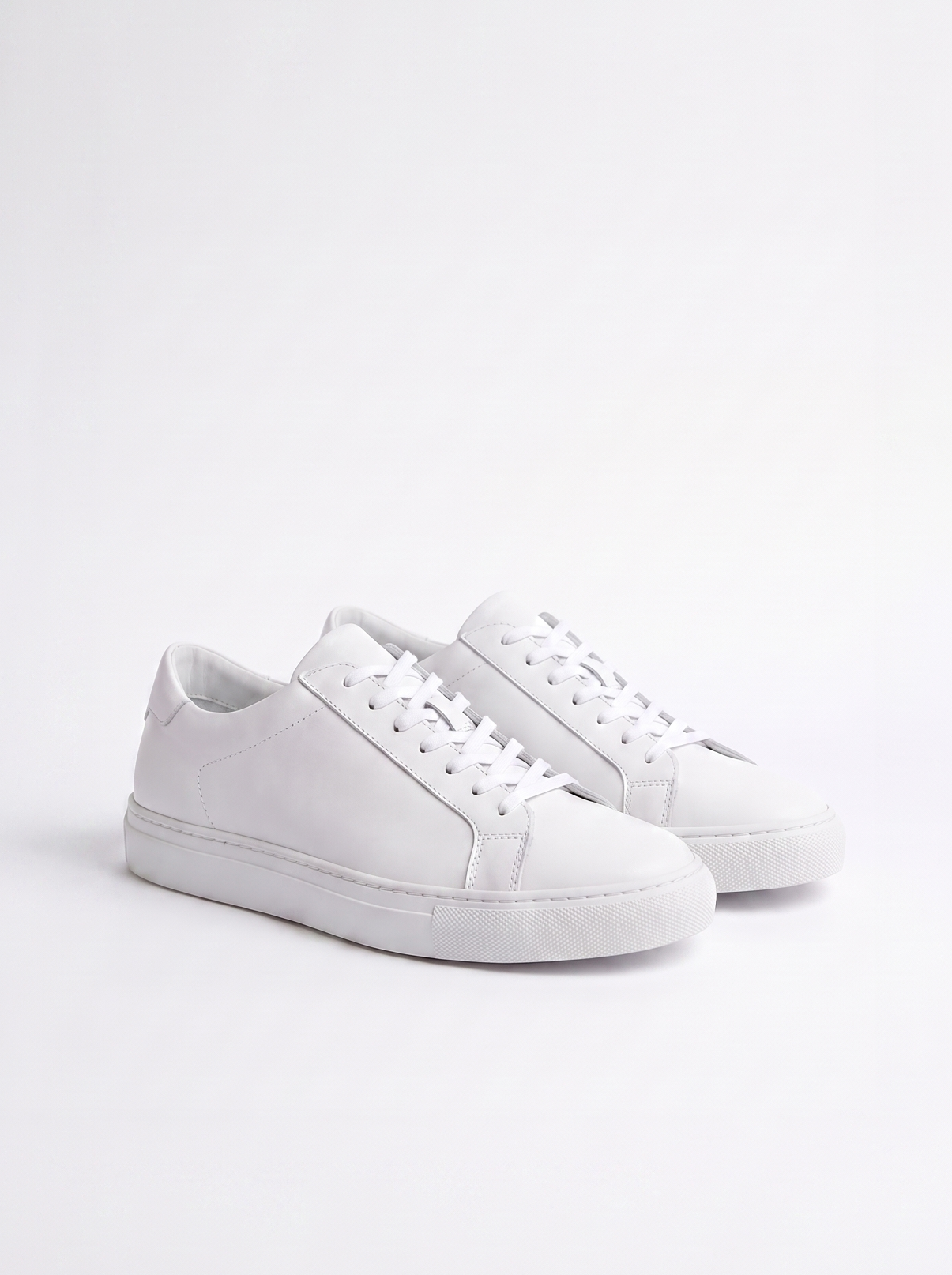 White sneakers on a light gray background