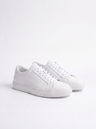 White sneakers on a light gray background