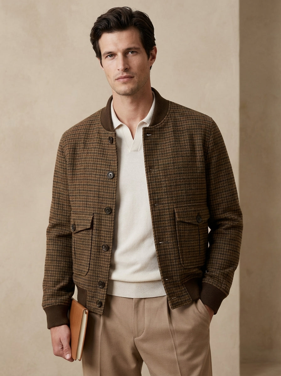 Man wearing a brown checkered jacket over a white shirt with a beige background
