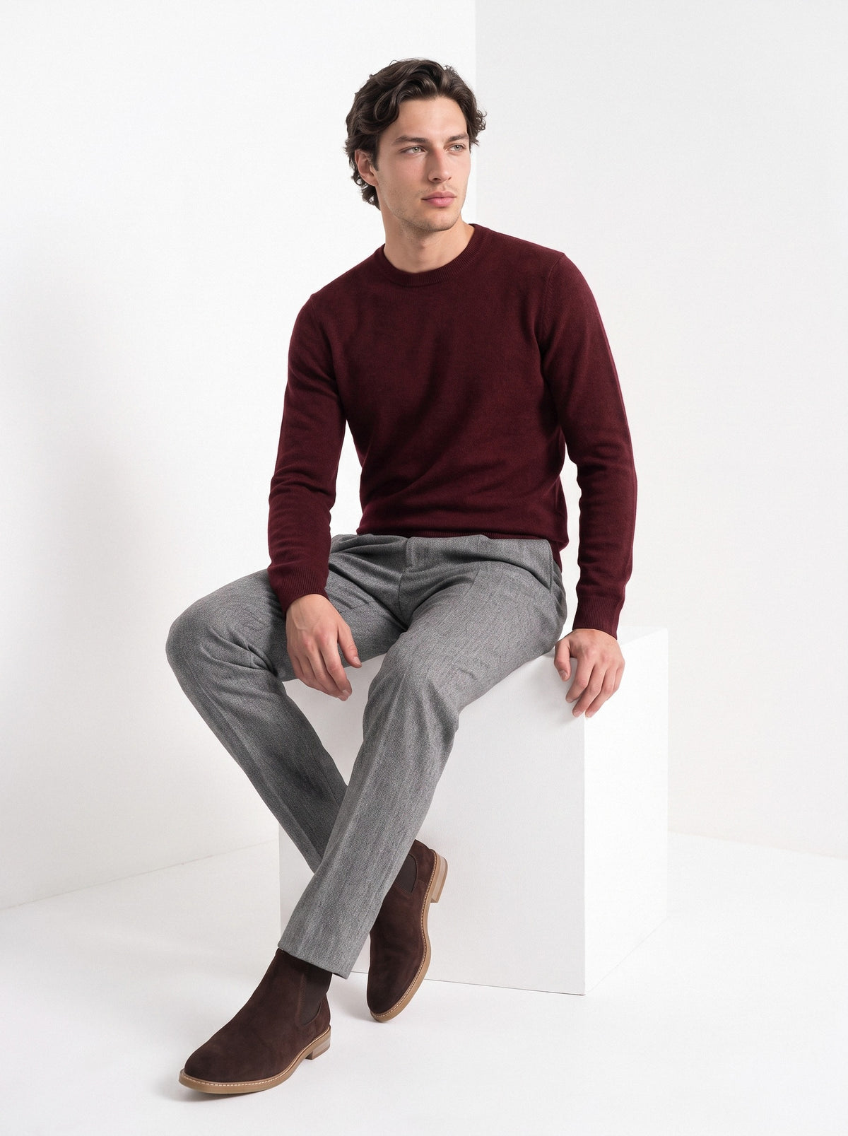 BLENIN men's 100% wool crew neck sweater in burgundy, seated, full outfit