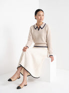 BLENIN piped collar sweater in oatmeal, seated, full outfit