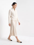 BLENIN cable knit zip cardigan in ivory, full outfit, walking
