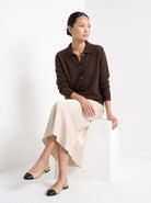 BLENIN collared button cardigan in chocolate, seated, full outfit