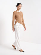 BLENIN gold button knit top in camel, full outfit, walking