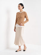 BLENIN gold button knit top in camel, three-quarter view