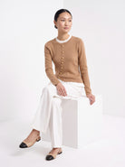 BLENIN gold button knit top in camel, seated, full outfit