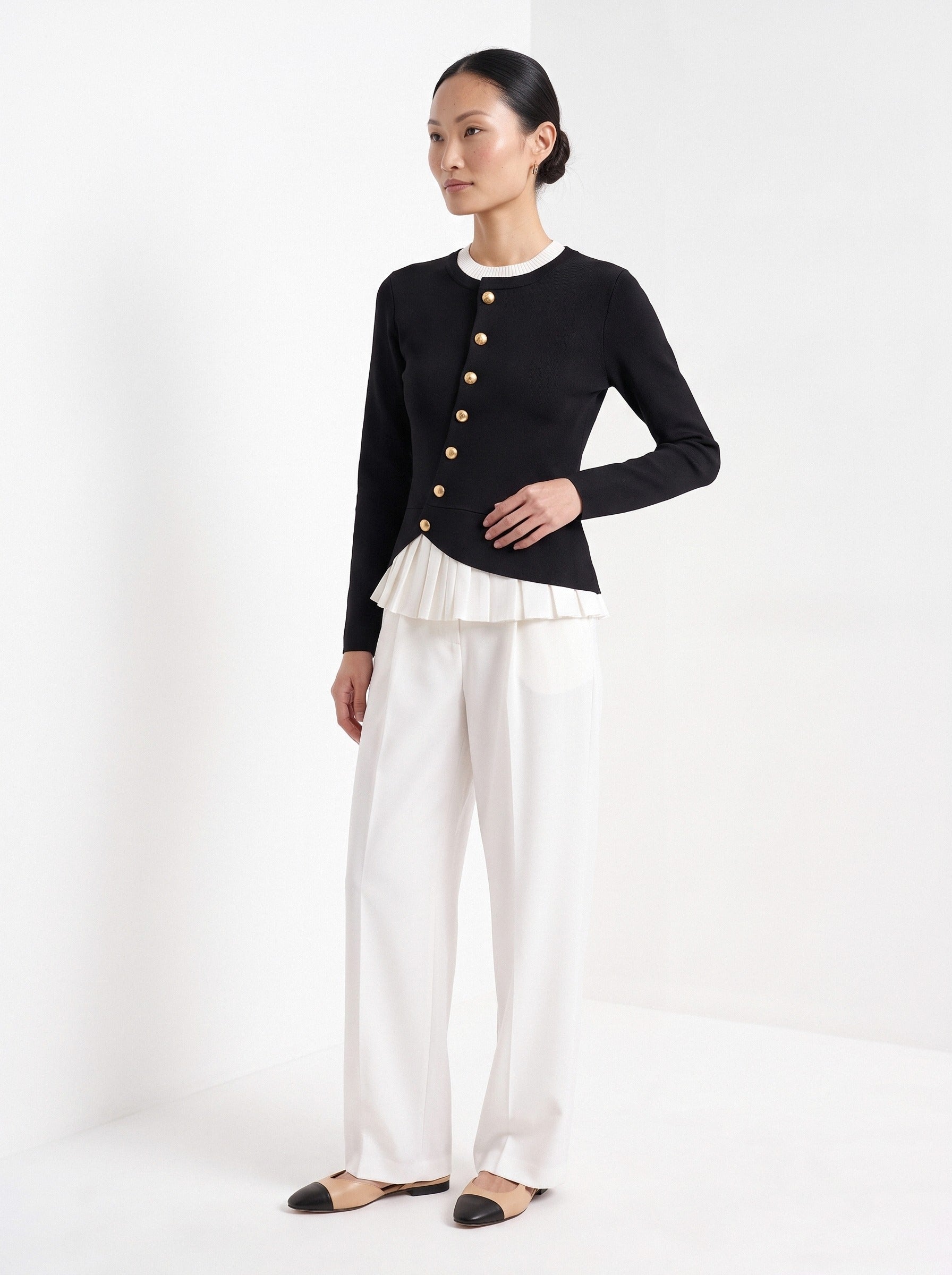 BLENIN gold button knit top in black, three-quarter view