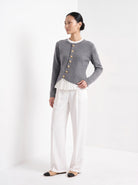 BLENIN gold button knit top in grey, three-quarter view