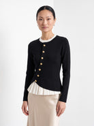 BLENIN gold button knit top in black, front portrait