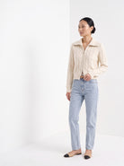 BLENIN cable zip collar cardigan in cream, three-quarter view