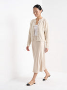 BLENIN knot button cardigan in cream, full outfit, walking