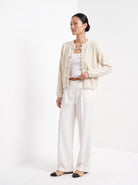 BLENIN knot button cardigan in cream, three-quarter view