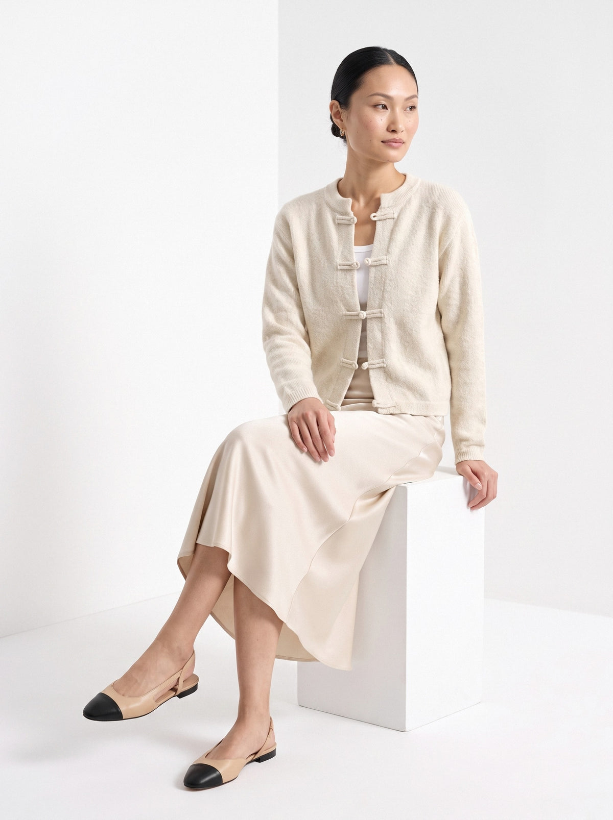 BLENIN knot button cardigan in cream, seated, full outfit