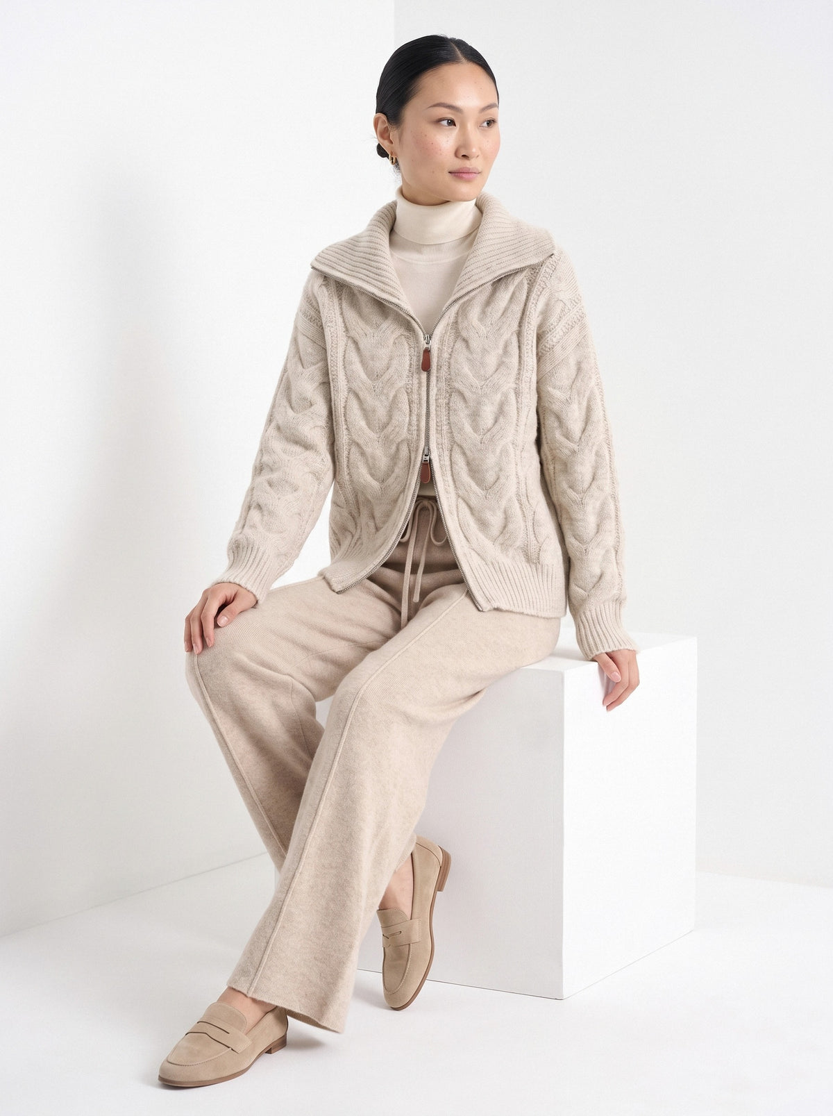 BLENIN wide collar cable zip cardigan in oatmeal, seated, full outfit