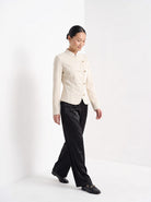 BLENIN stand collar fitted jacket in cream, full outfit, walking