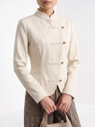 BLENIN stand collar fitted jacket in cream, close-up of the details