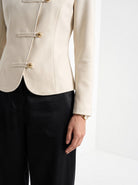 BLENIN stand collar fitted jacket in cream, fit detail at the hem and cuff