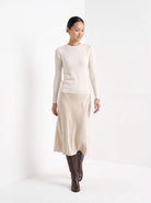 BLENIN cashmere mock neck sweater in milky, full outfit, walking