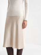 BLENIN cashmere mock neck sweater in milky, fit detail at the hem and cuff