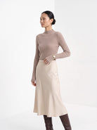 BLENIN cashmere mock neck sweater in camel, three-quarter view
