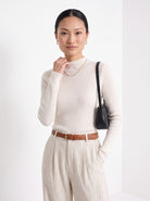 BLENIN cashmere mock neck sweater in milky, front portrait