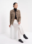 BLENIN herringbone field jacket in camel, seated, full outfit