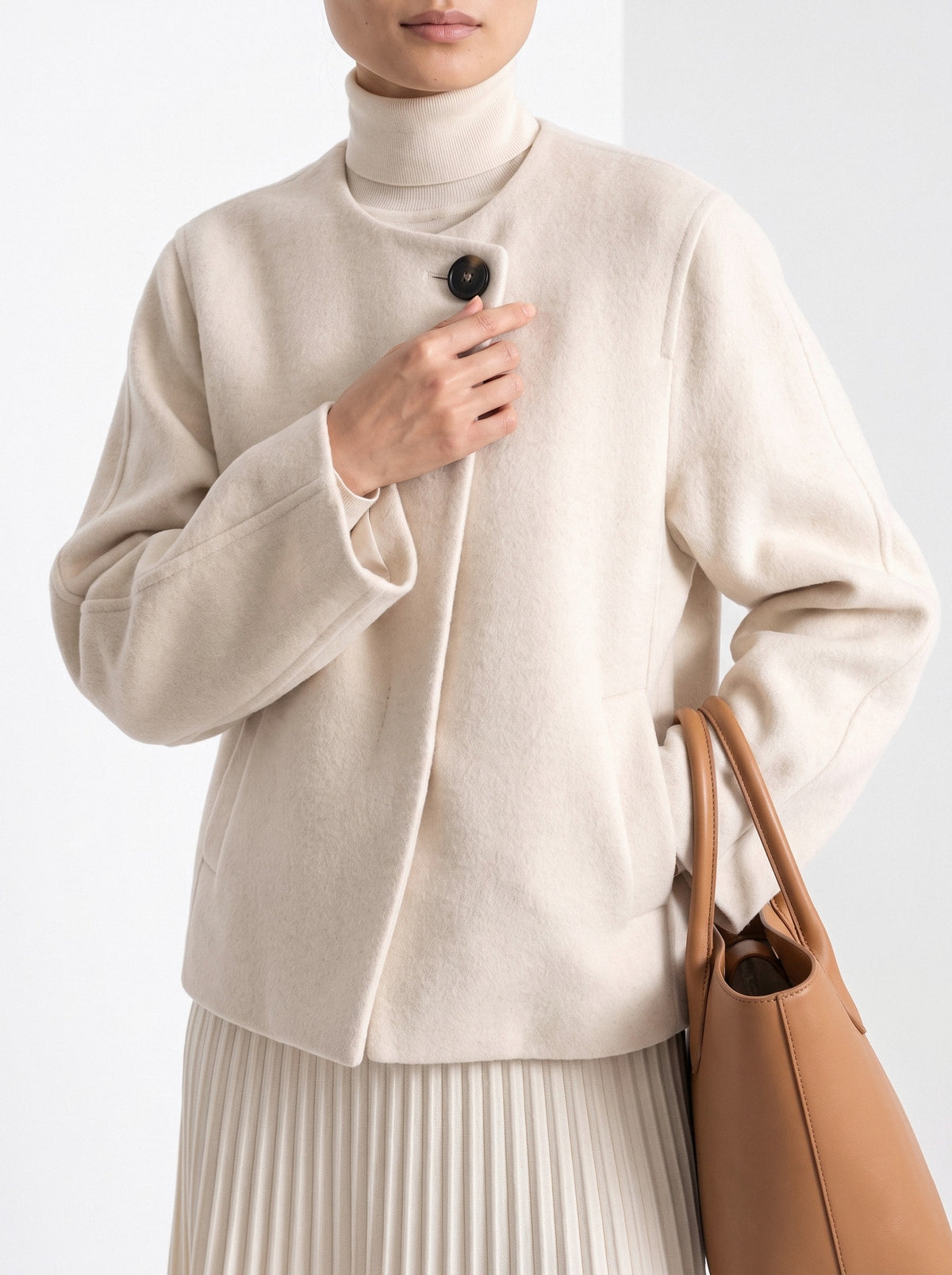 BLENIN collarless short coat in cream, close-up of the details